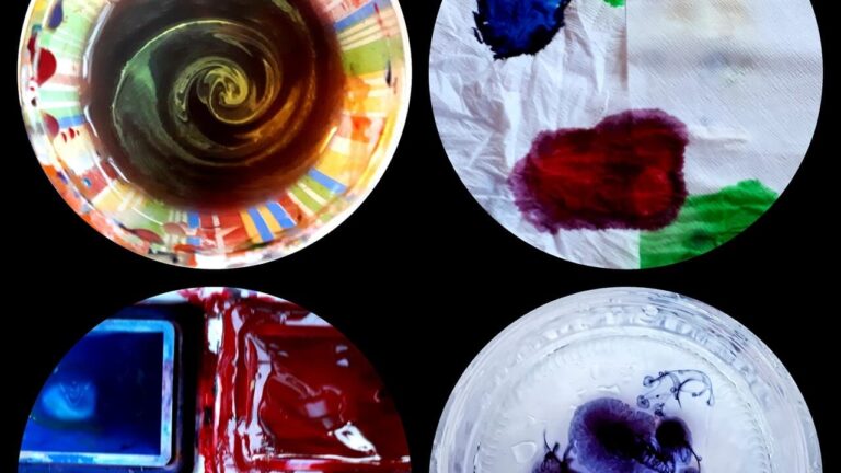 Four plates displaying various colors of paint: red, blue, yellow, and green, arranged artistically.